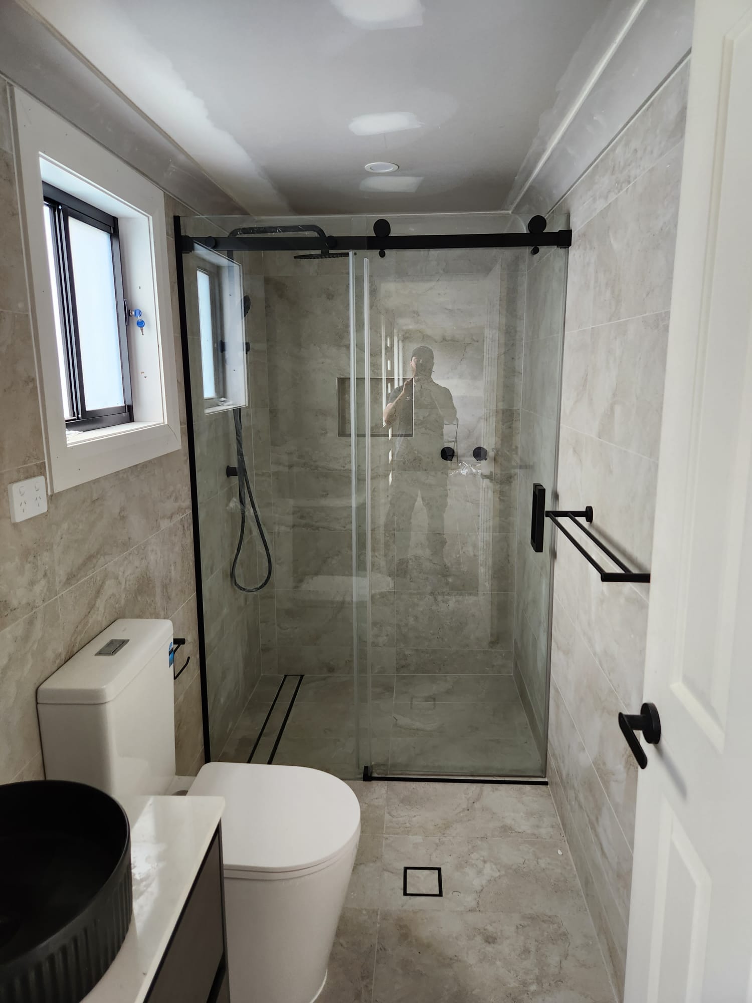 Sydney bathroom renovation with frameless shower and matte black tapware